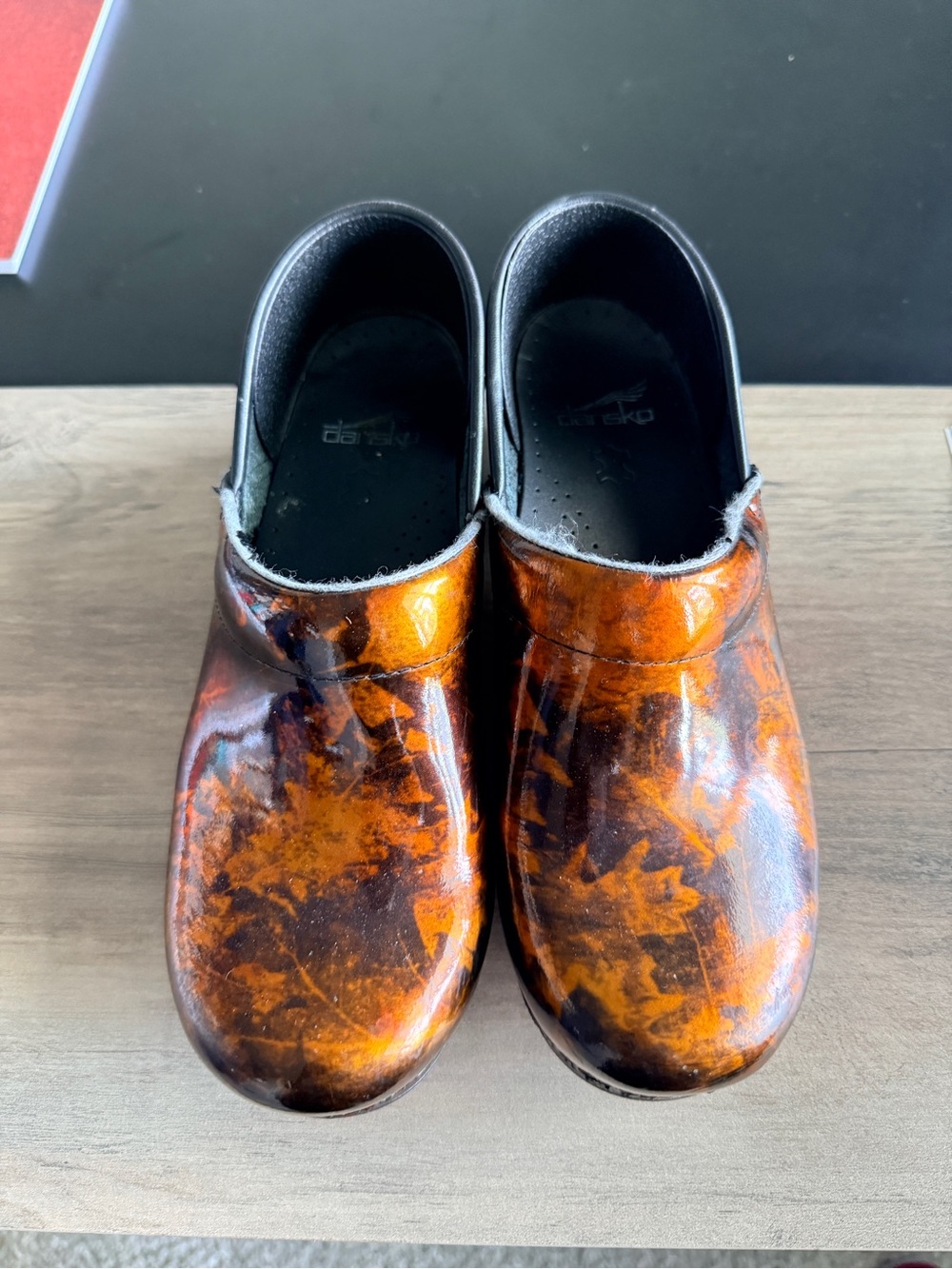 Dansko Slip-On Clogs in Burnt Orange and Brown Marbled Patent
